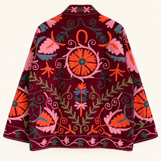 Burgundy velvet with coral and pink floral embroidery on this Suzani jacket