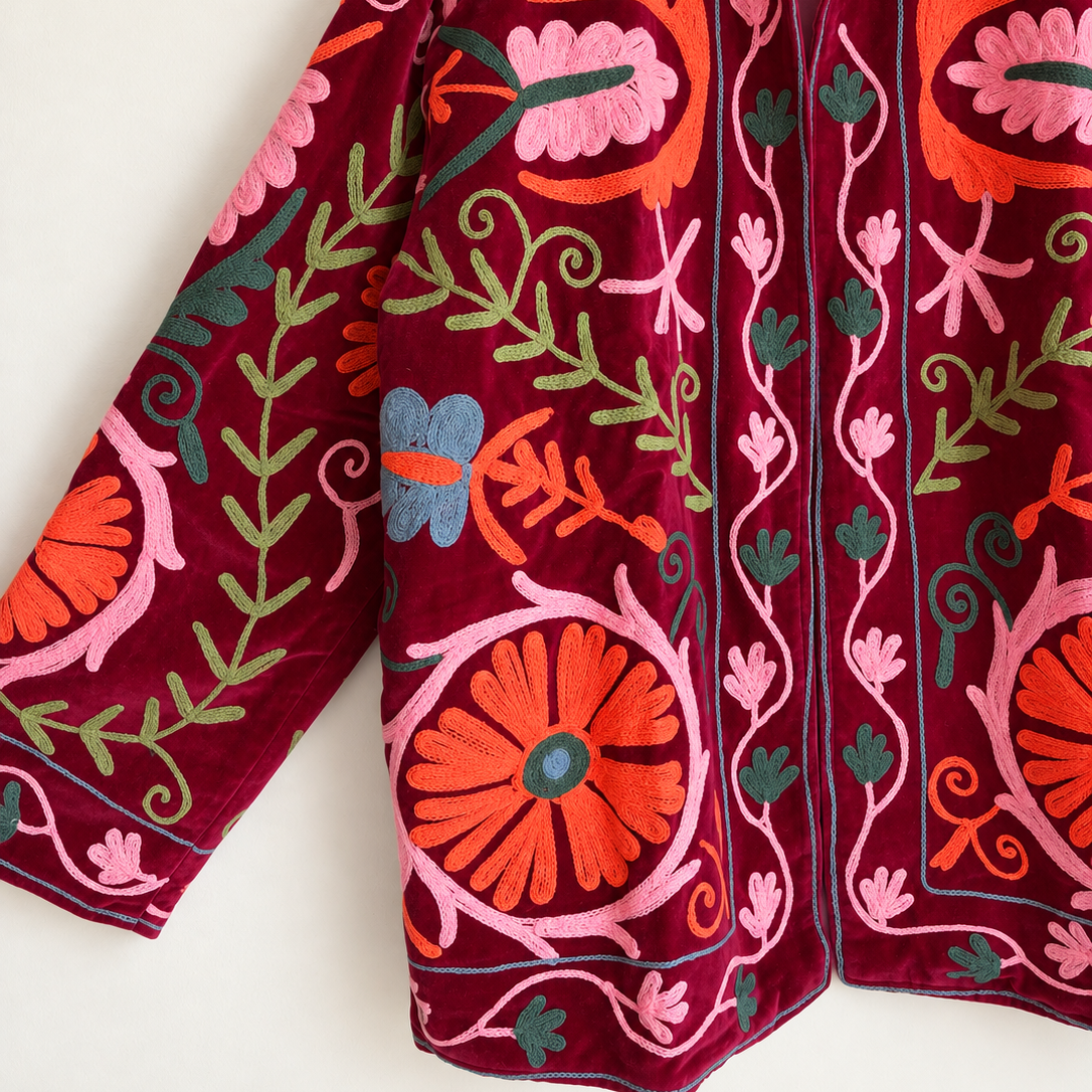 Burgundy velvet with coral and pink floral embroidery on this Suzani jacket