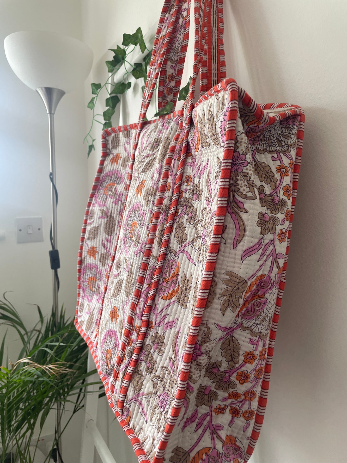 Floral patterned fabric with red and purple side view