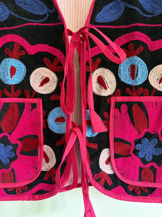 Fuchsia suzani embroidery vest UK close up floral embroidery velvet detail
