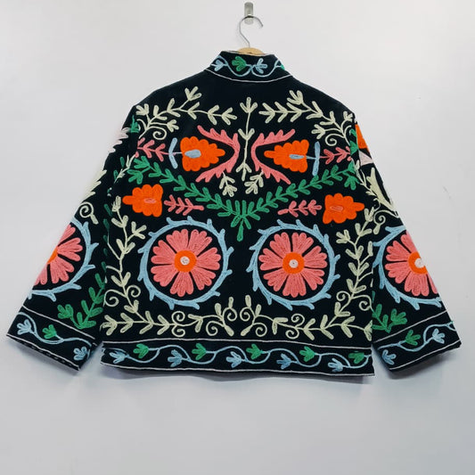 Embroidered jacket with floral patterns on a white background