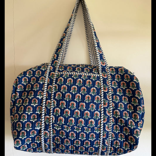 Blue quilted duffle bag UK front view handmade overnight travel bag