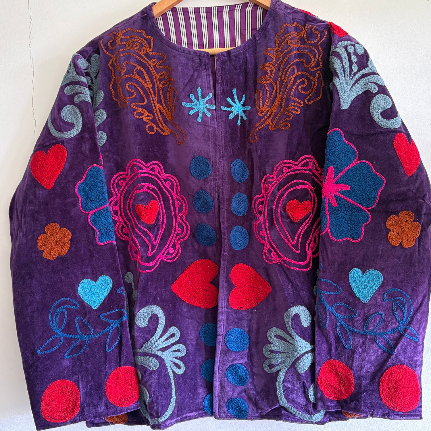 Purple Embroidery Jacket with colorful patterns on a white background