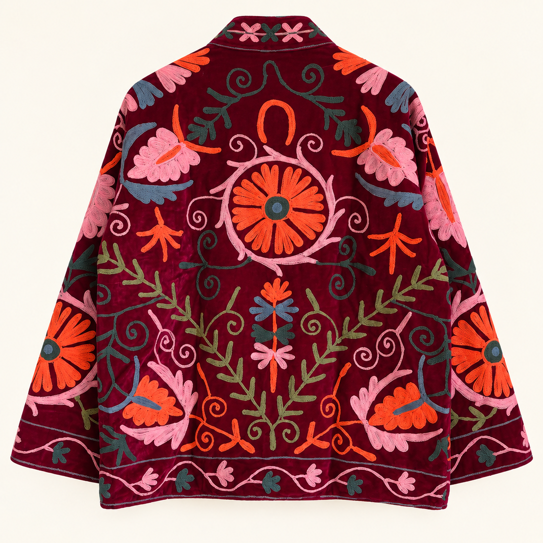 Burgundy velvet with coral and pink floral embroidery on this Suzani jacket