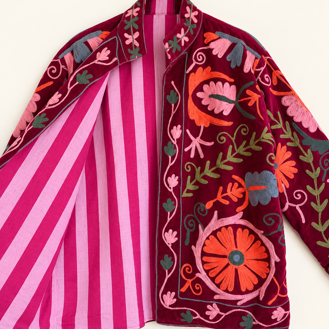 Burgundy velvet with coral and pink floral embroidery on this Suzani jacket