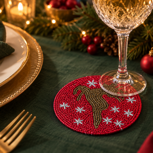 Red beaded coasters featuring a Reindeer silhouette and white star details. 
