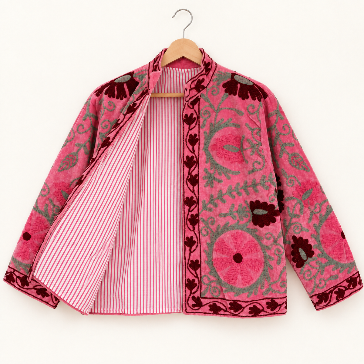 Pink Suzani embroidered Velvet jacket with green and dark red floral patterns. 