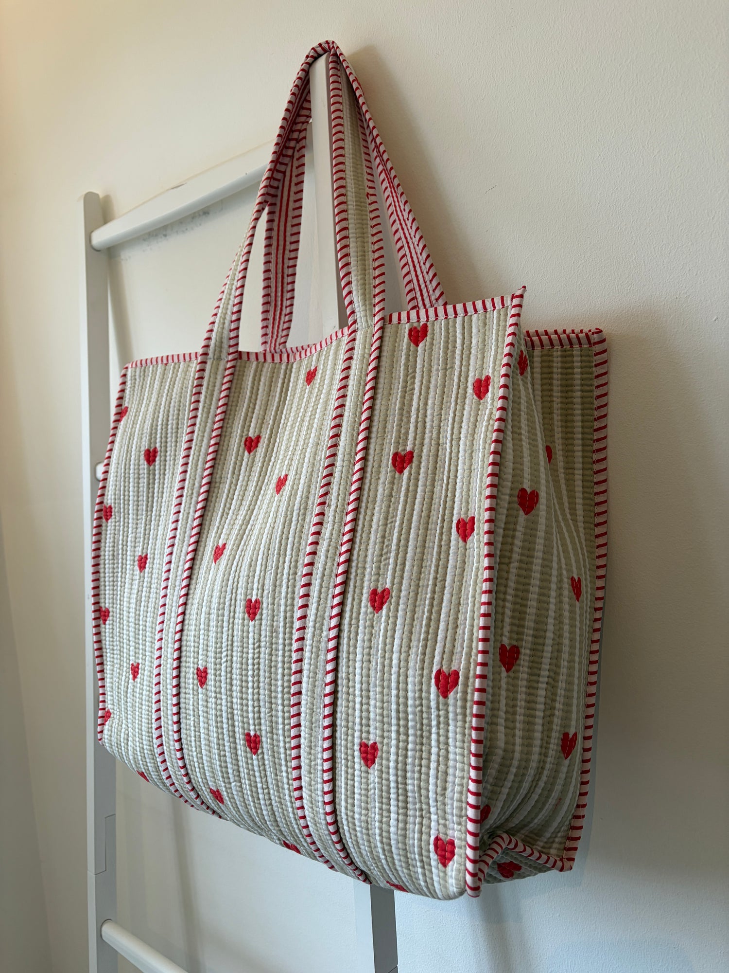 Quilted Tote Bag with red heart pattern on a white background