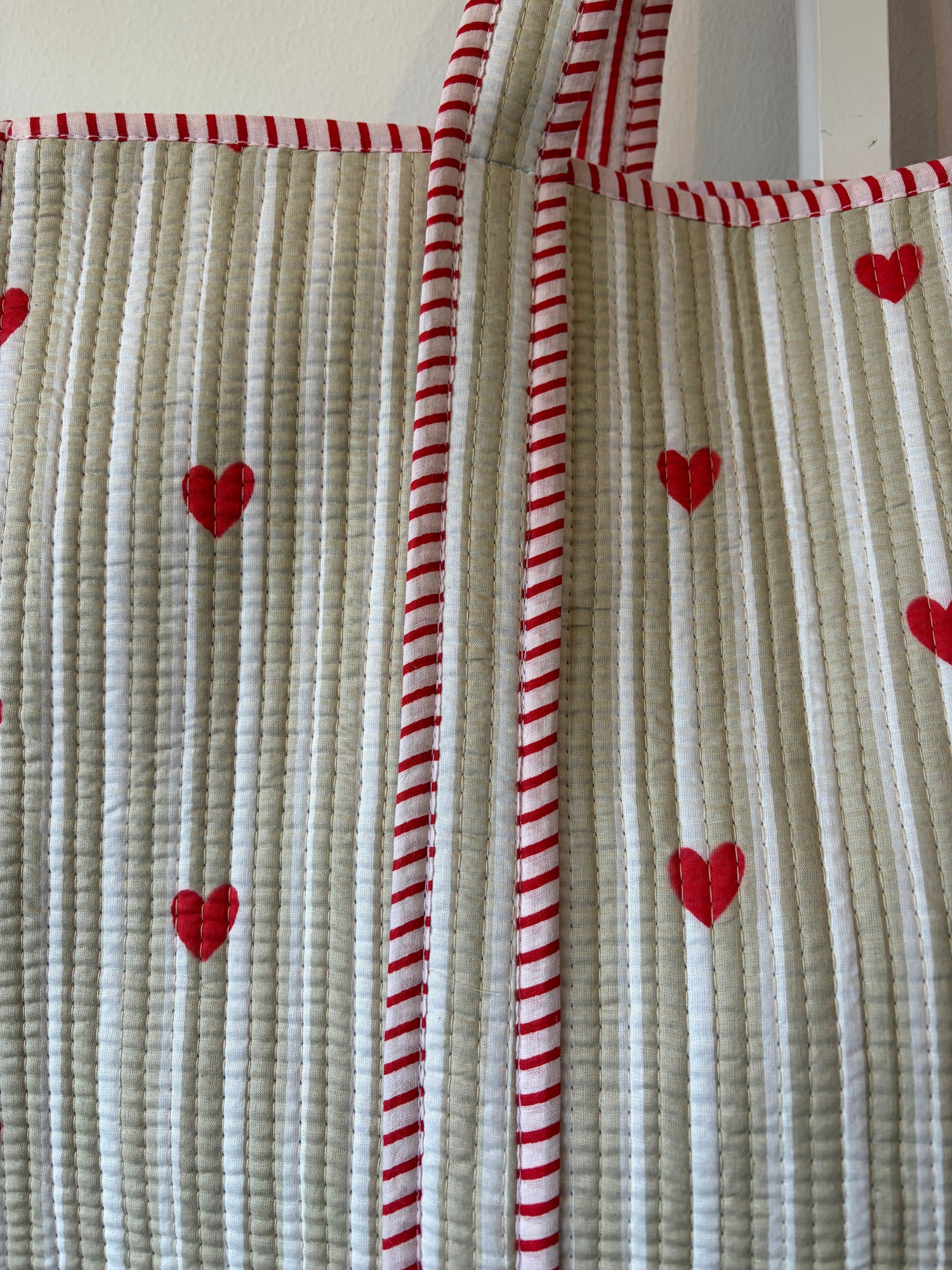 Cotton quilted red heart patterns and red and white striped border