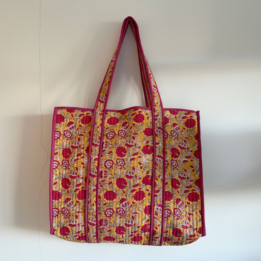 Floral patterned bag with a pink border on a white background