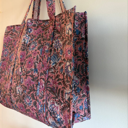 Pink Block Print Cotton Quilted Tote Bag – Handmade Tote with floral pattern hanging on a wall.