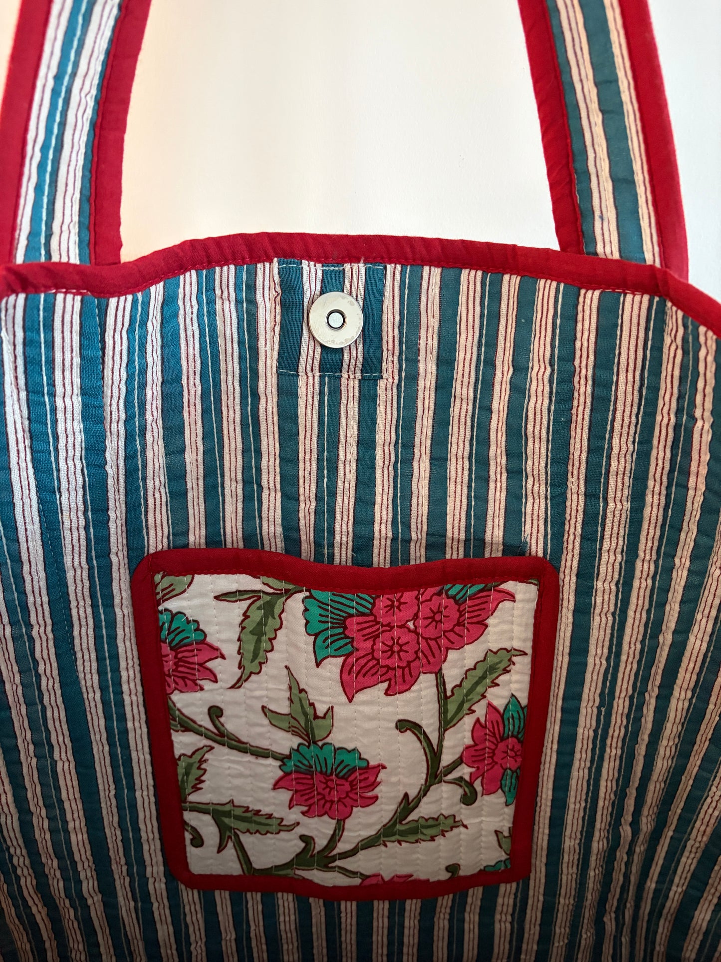 White Block Print Cotton Quilted Tote Bag – Handmade Tote featuring charming floral pocket and striped design.