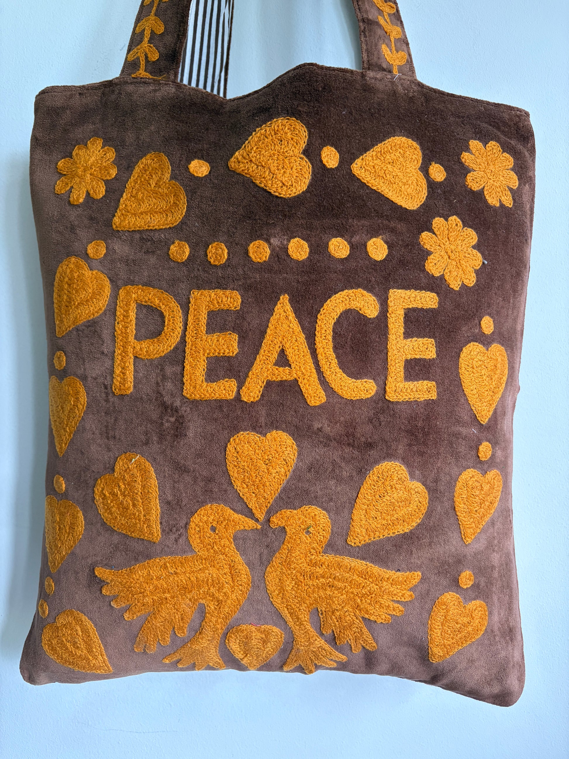 Brown Velvet Tote bag with mustard peace and heart Suzani Embroidery on a white background