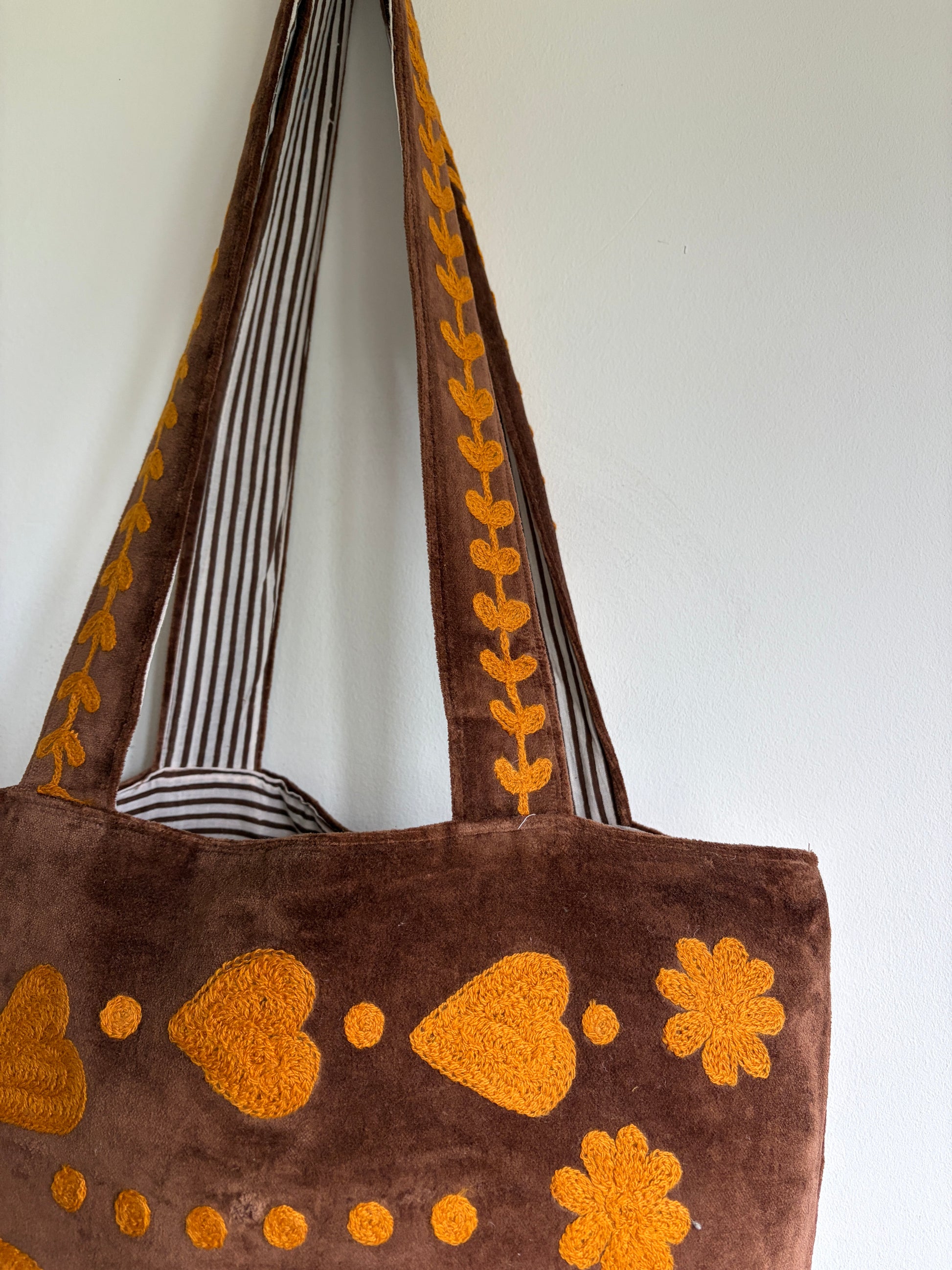 Brown Velvet Tote bag with mustard peace and heart Suzani Embroidery on a white background