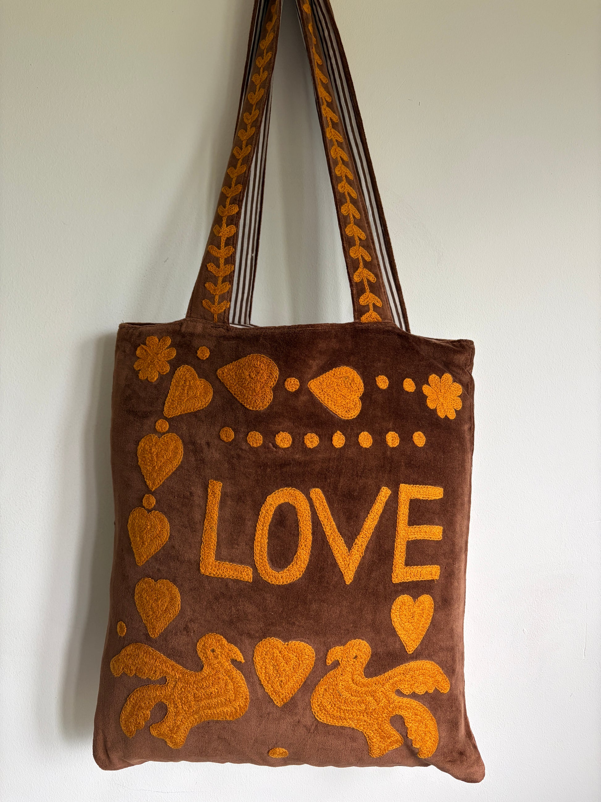Brown Velvet Tote bag with mustard peace and heart Suzani Embroidery on a white background