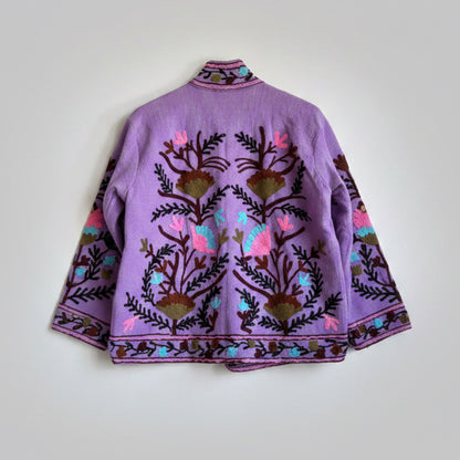 Purple embroidered jacket with floral patterns on a white background