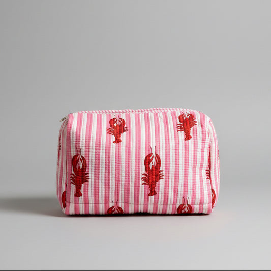 A pink and white striped cotton make up bag with red lobster prints.