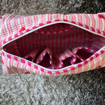 Quilted pink stripped tote bag with red hearted pattern.