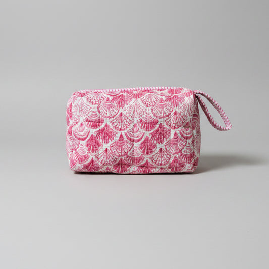 A pink and white patterned zippered make up bag with a matching loop handle.