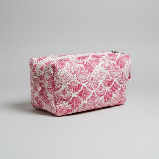 A pink and white patterned zippered make up bag with a matching loop handle.