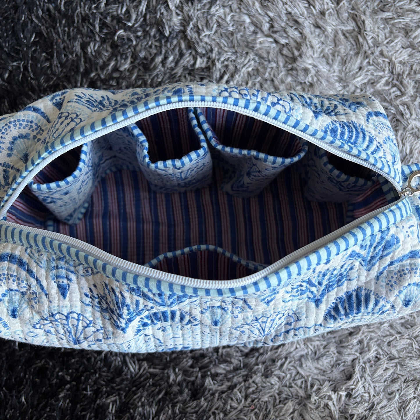 Quilted Cotton make up  bag with a blue and white shell design.