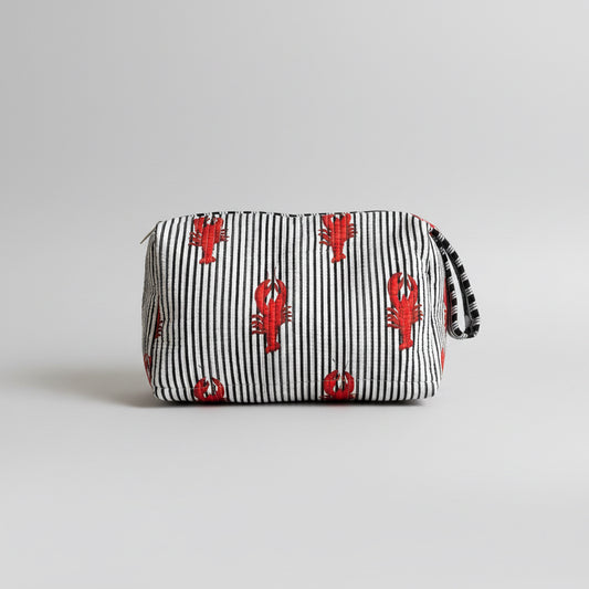 A striped fabric make up bag with red lobster prints.