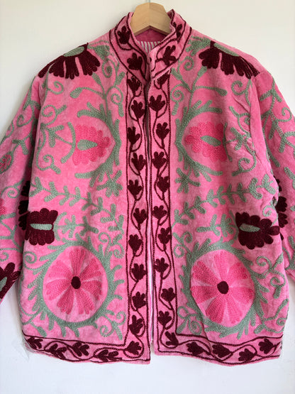 Pink Suzani embroidered Velvet jacket with green and dark red floral patterns. 