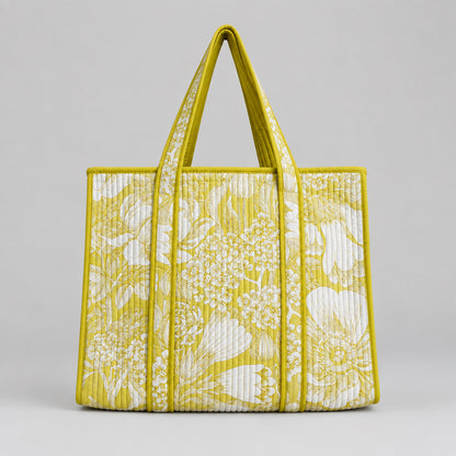 Cotton Quilted tote bag with a yellow and white floral pattern. 