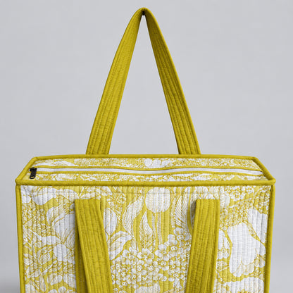 Cotton Quilted tote bag with a yellow and white floral pattern. 
