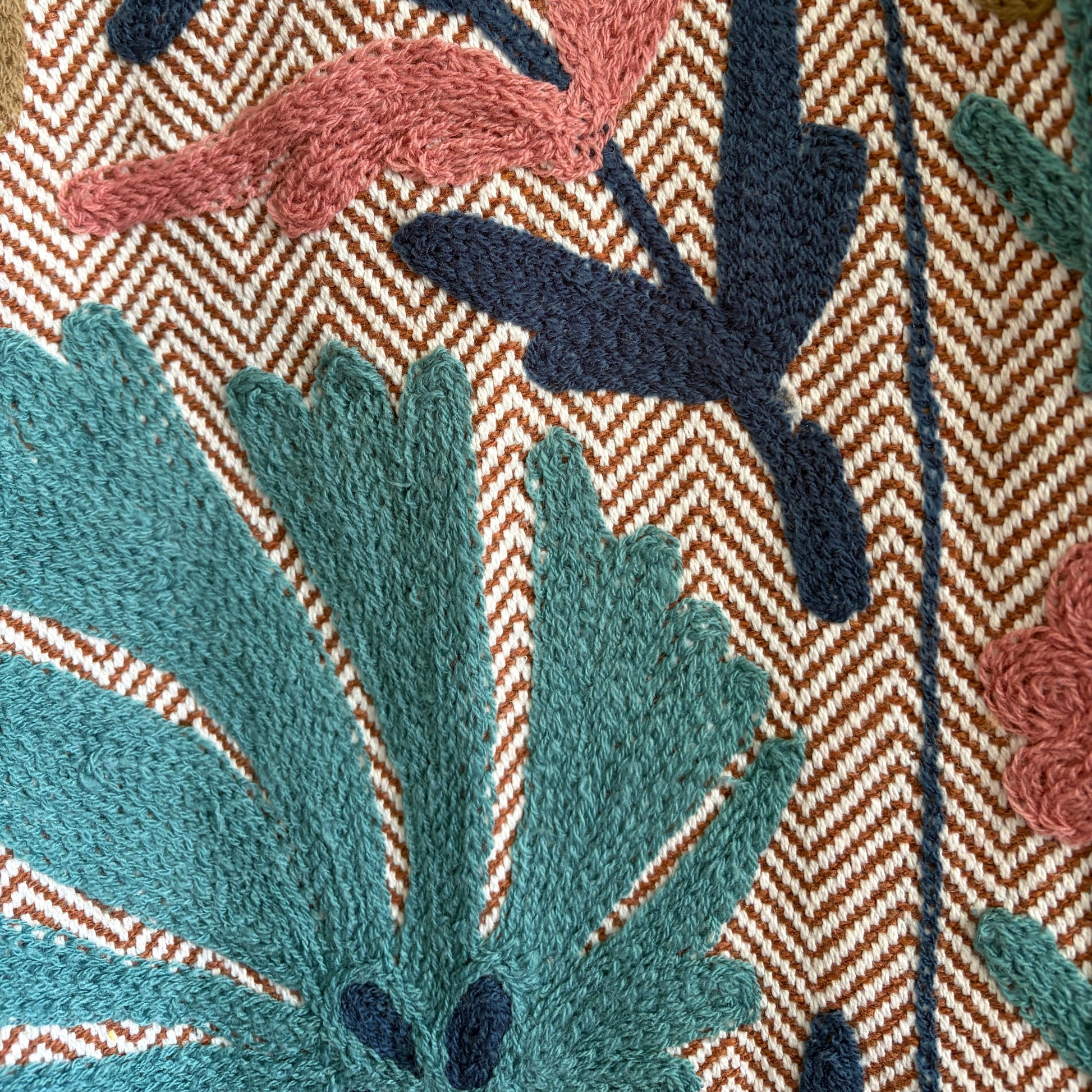 Floral-patterned headscarf and striped fabric on a close view