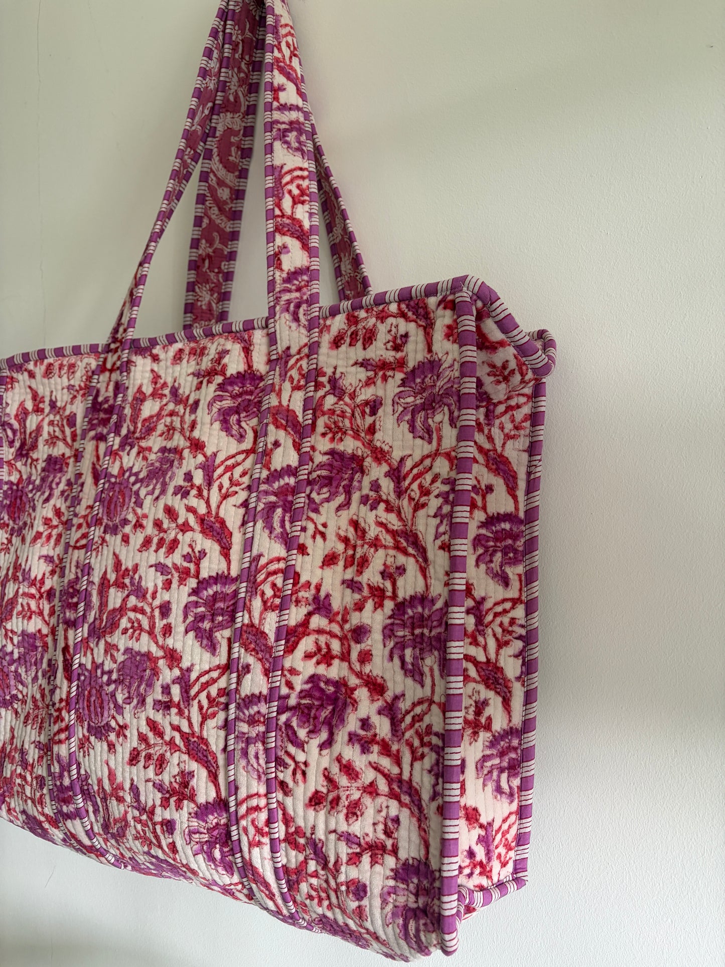 Fabric storage bin with floral pattern on a white background