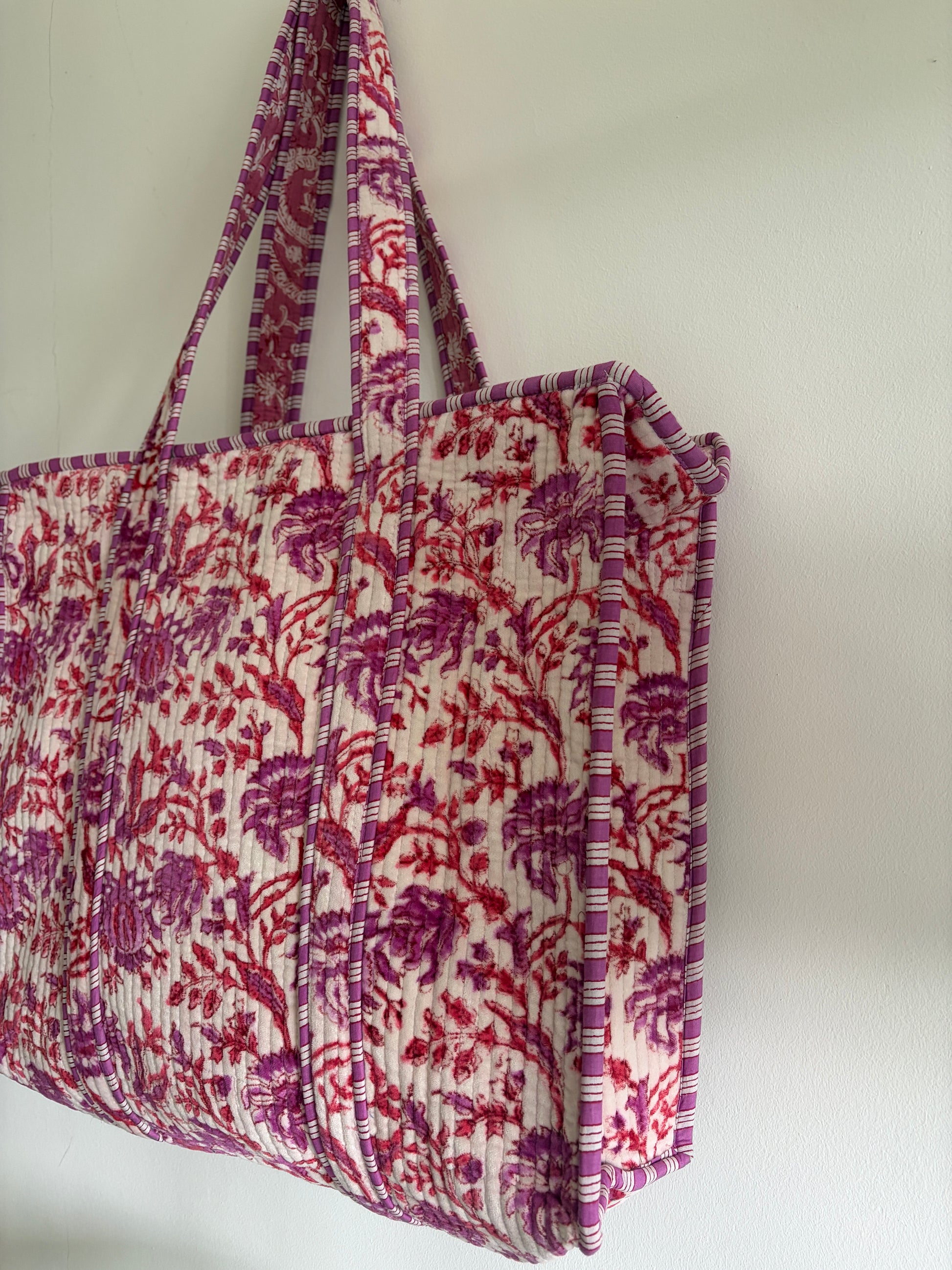 Fabric storage bin with floral pattern on a white background