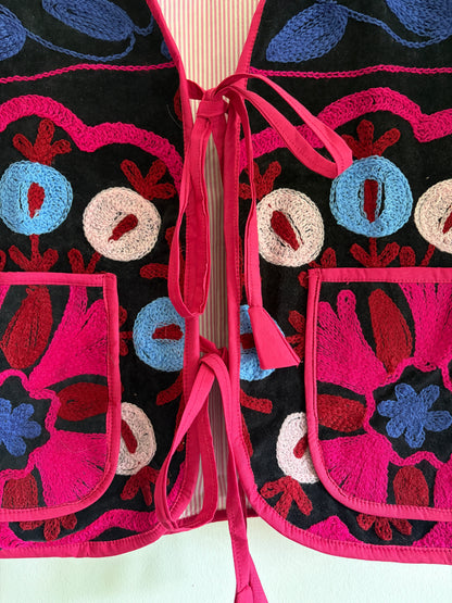 Fuchsia suzani embroidery vest UK close up floral embroidery velvet detail