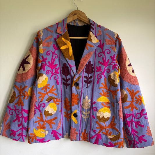 Colorful embroidered Blazer with floral patterns on a beige background