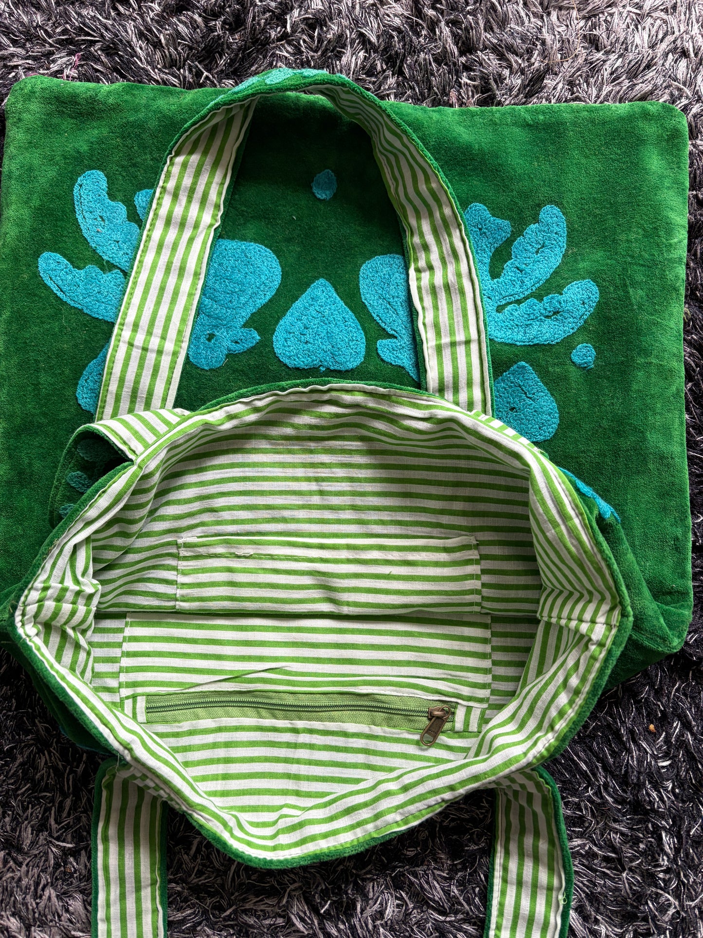 Green Suzani Velvet bag with blue hearts and 'LOVE' on a beige background
