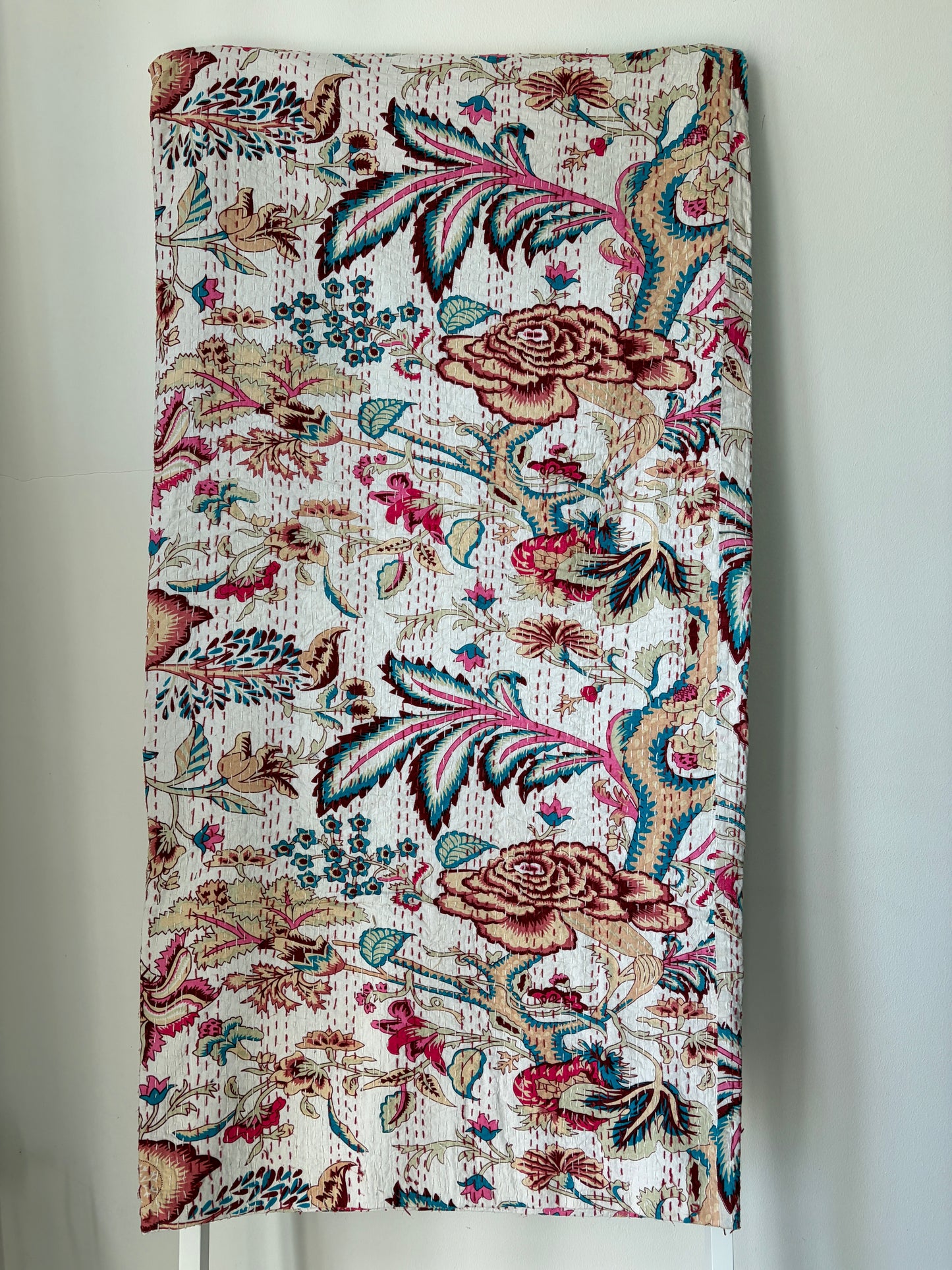 Kantha bedcover on white background
