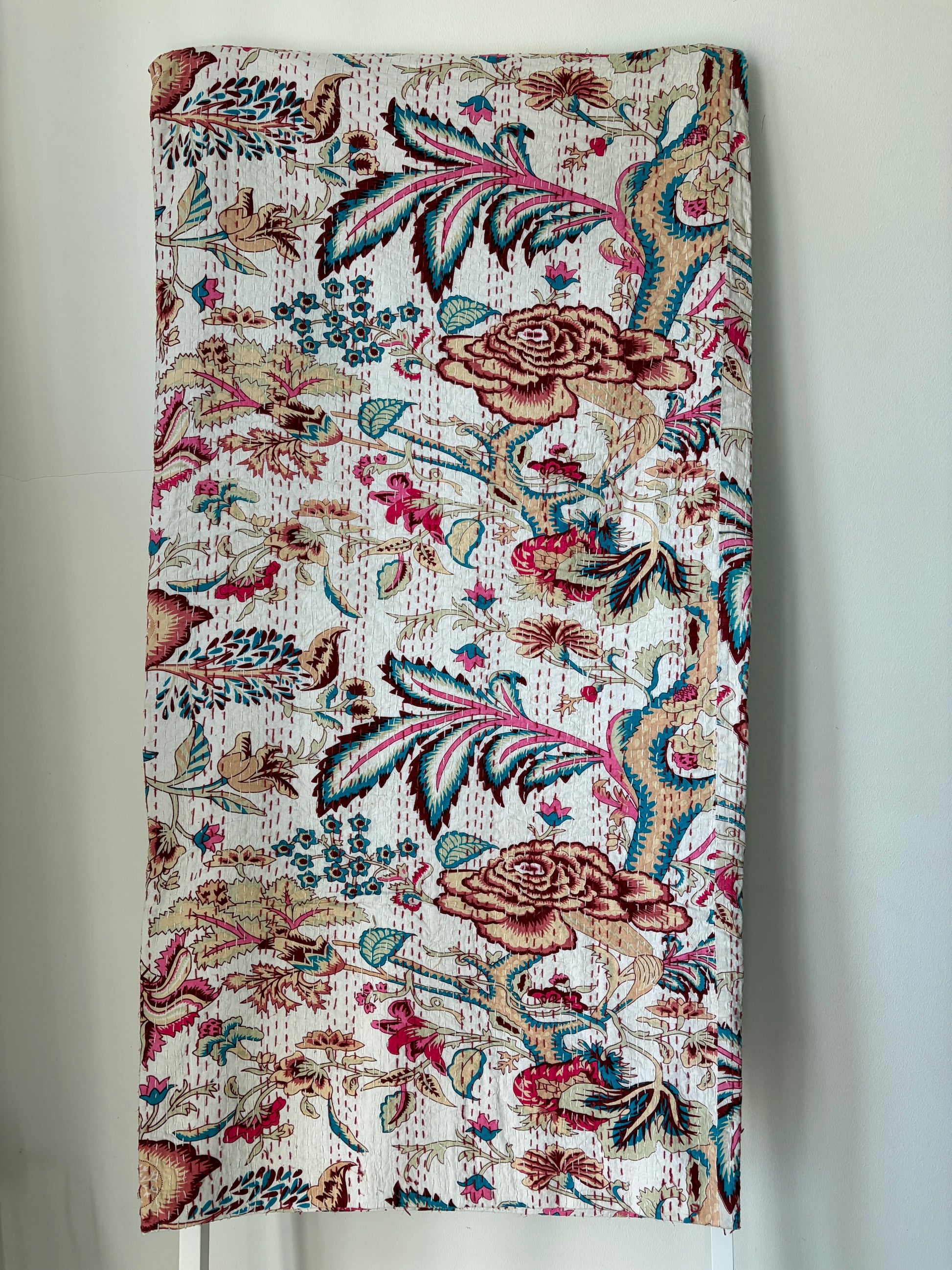 Kantha bedcover on white background