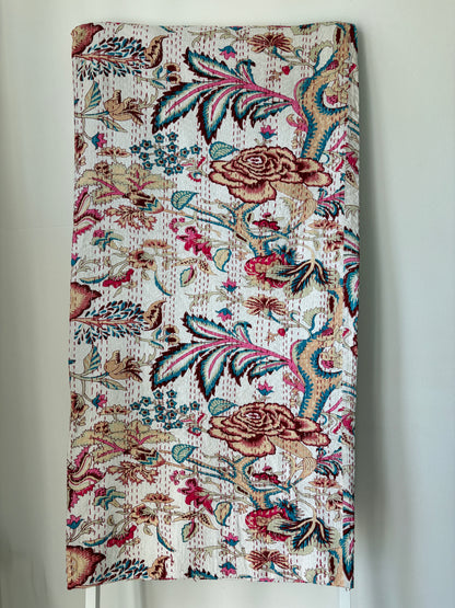 Kantha bedcover on white background