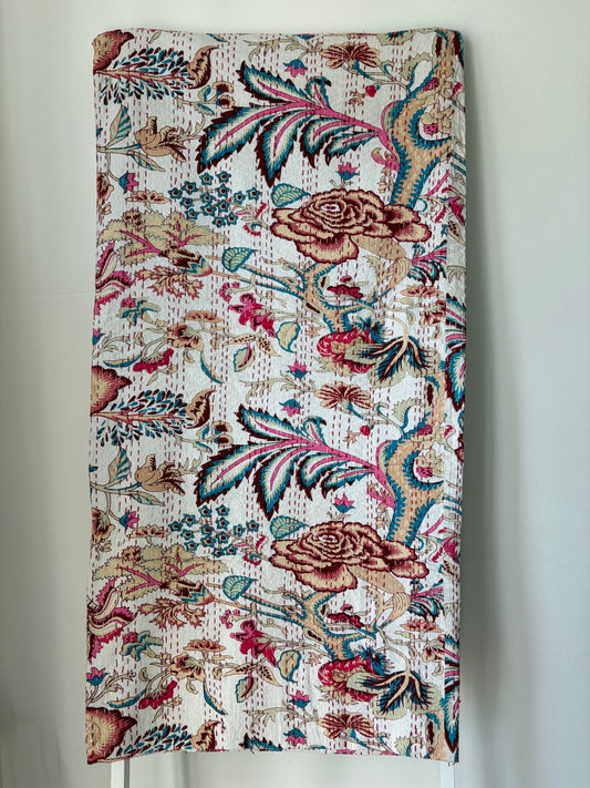 Kantha bedcover on white background