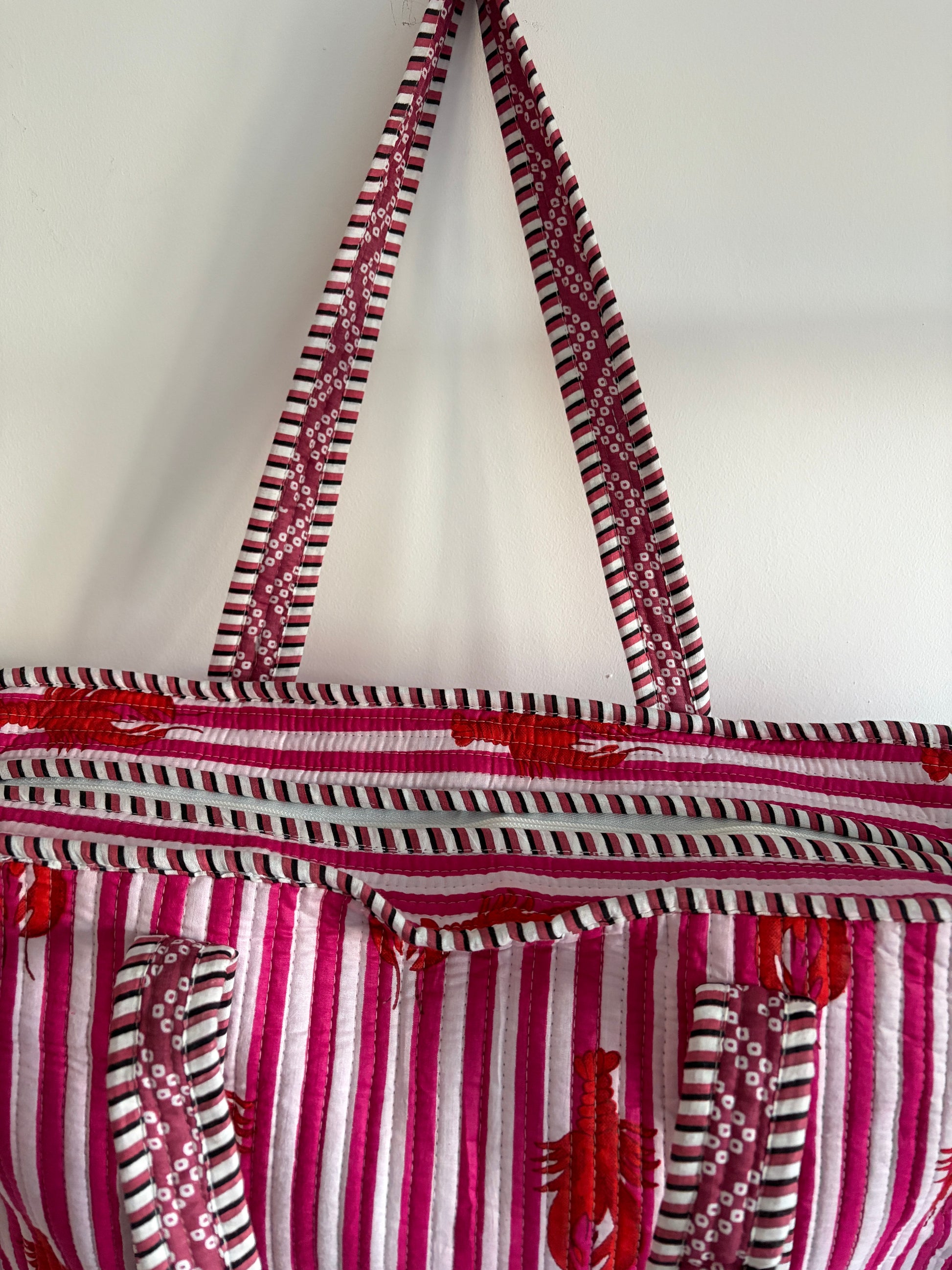Striped bag with red and white pattern on a white background