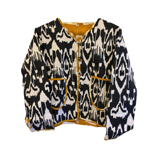 Black and white patterned jacket with yellow accents on a white background