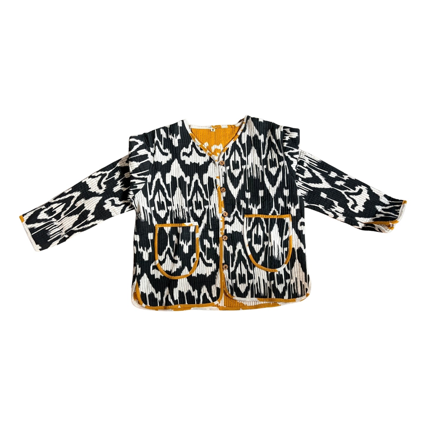 Black and white patterned jacket with orange accents on a white background