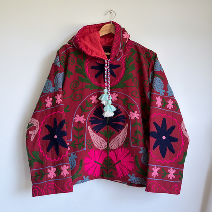 Deep Red Suzani embroidered hoodie with floral and scroll patterns. 