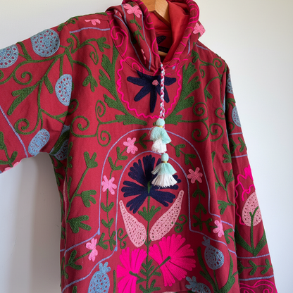 Deep Red Suzani embroidered hoodie with floral and scroll patterns. 