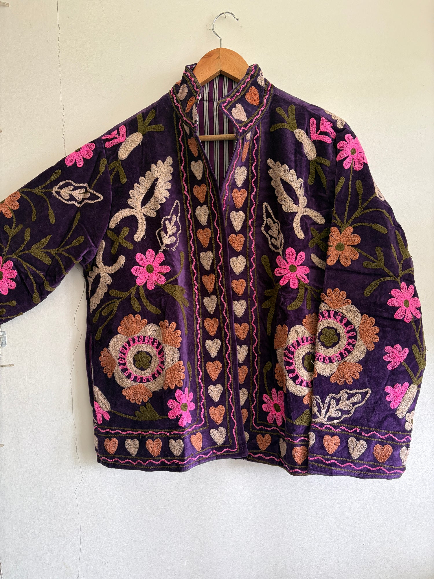 Embroidered Jacket with floral patterns on a white background