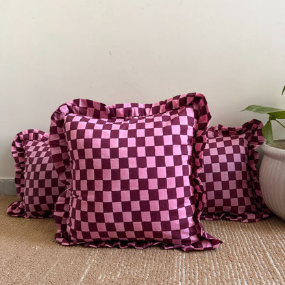 Pink and deep burgundy checkerboard design cushion covers