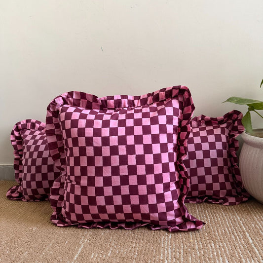 Pink and deep burgundy checkerboard design cushion covers