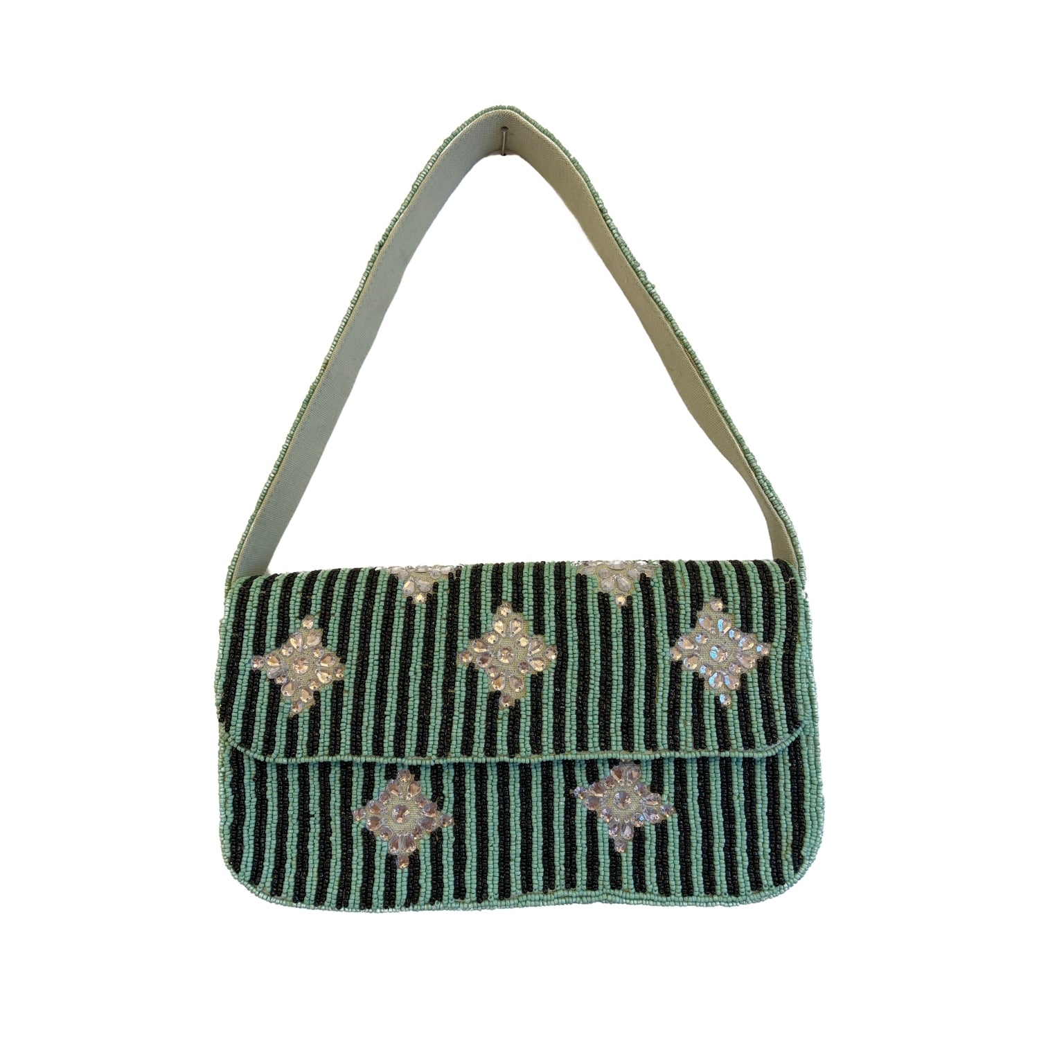 Green handbag with decorative patterns on a white background