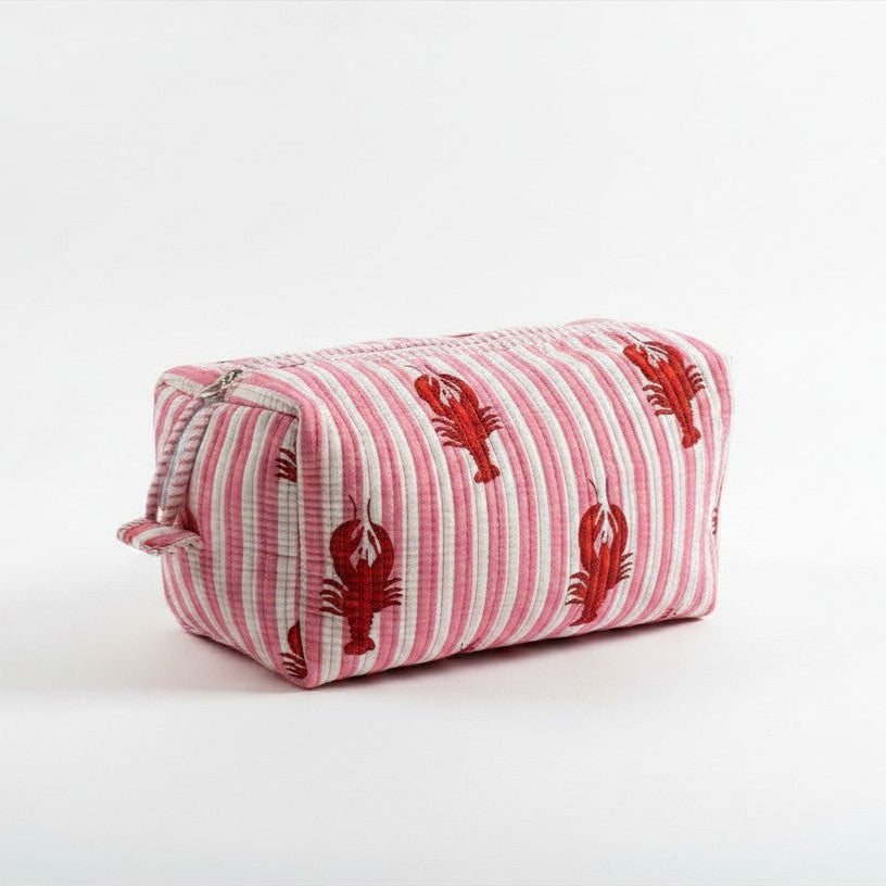 A pink and white striped cotton make up bag with red lobster prints.