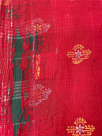 Red fabric with gold and white patterns